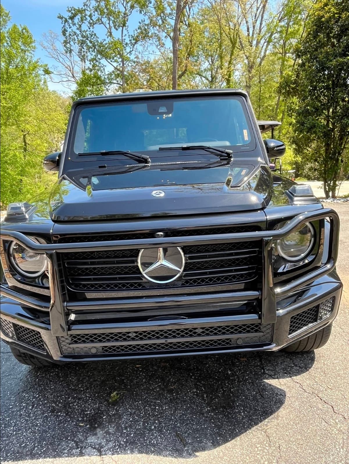 Head-on view of a detailed black Mercedes-Benz G-Wagon in Stilwell, Kansas.